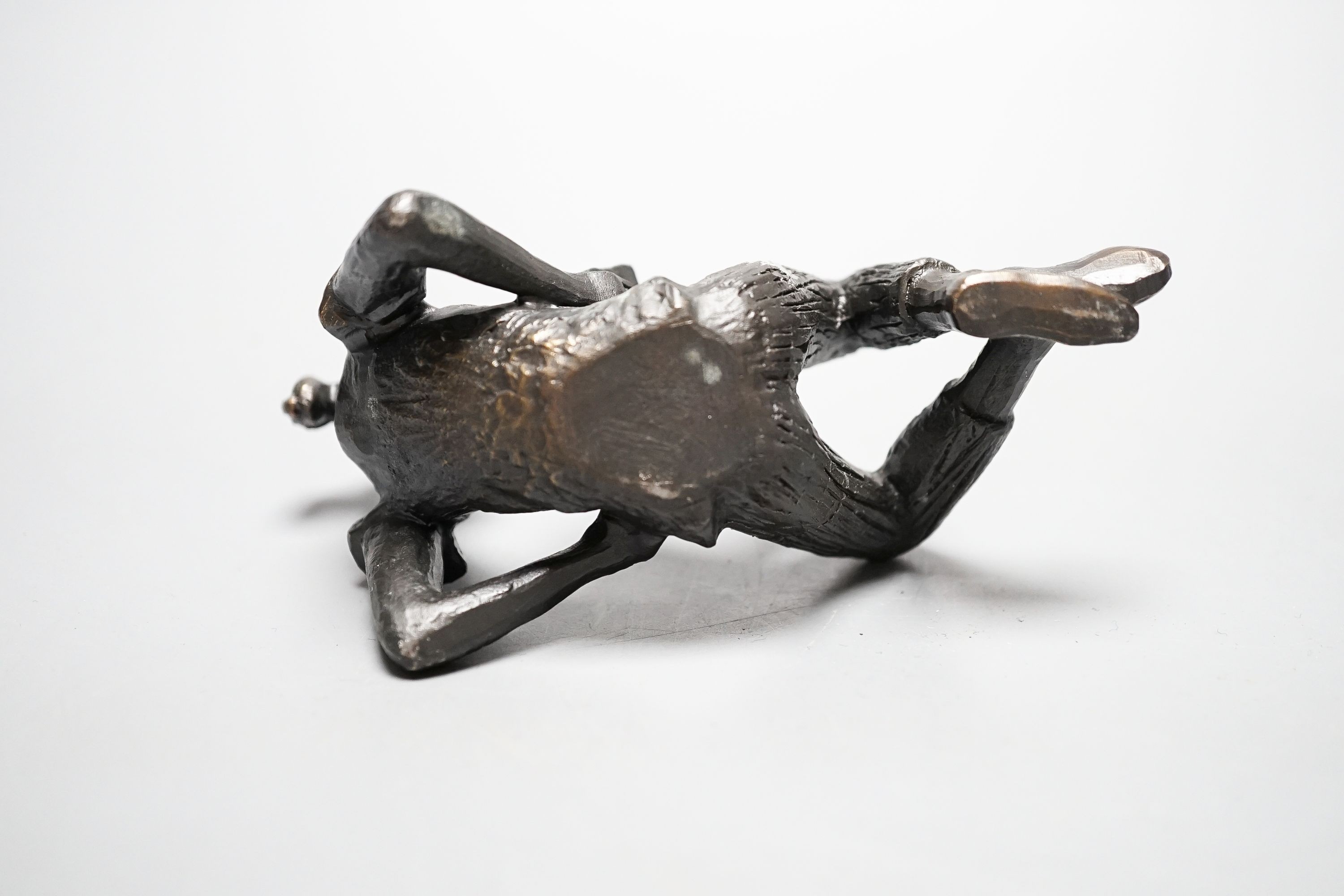 Gerda Rubinstein, (b. 1931). A bronze reclining girl, width 13cm